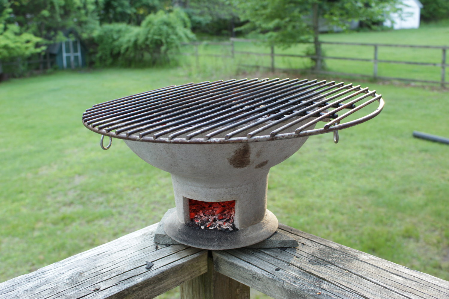 A coal pot, basin-shaped and containing coals, with a rack for grilling. They can be cast iron or clay. Enormously popular in the Caribbean, coal pots came from Africa or India and can cook delicious food in the Islands... or here in the Delaware River Valley.